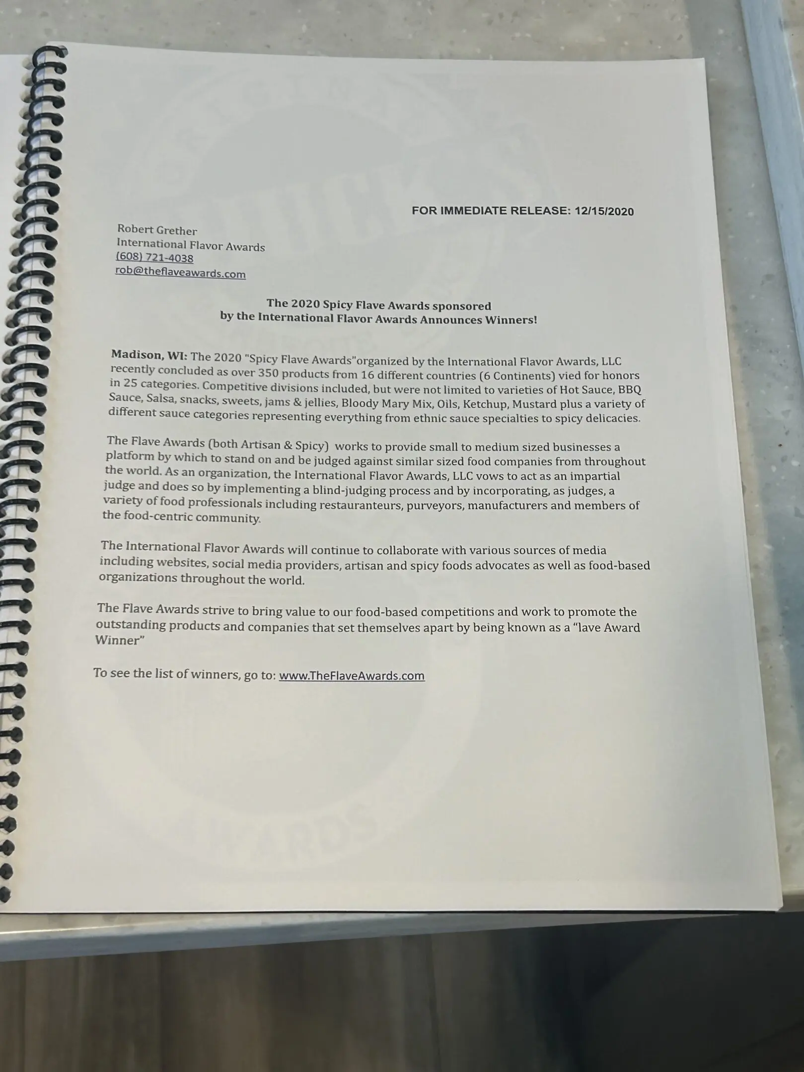 Spiral-bound press release page about flavor awards