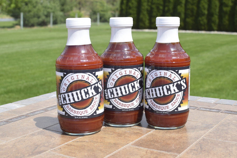 Trio of Chuck's sauce bottles displayed