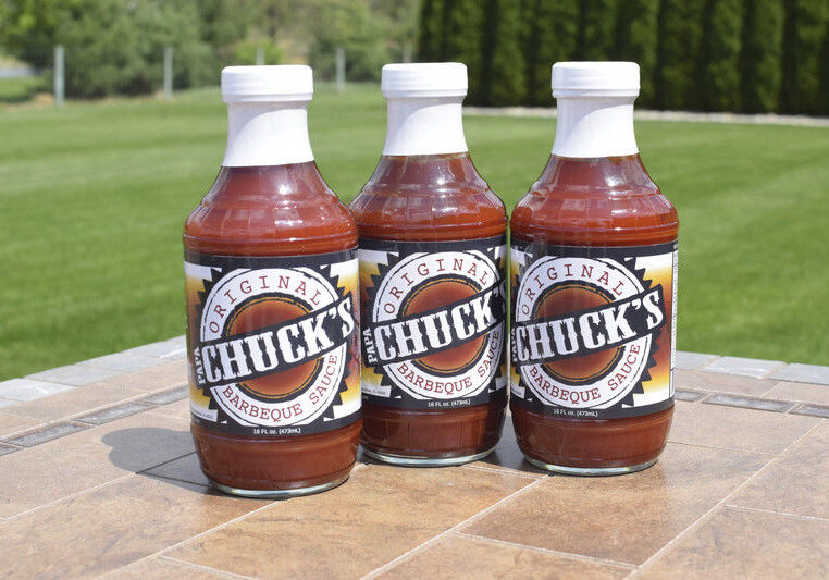 Trio of Chuck's sauce bottles displayed